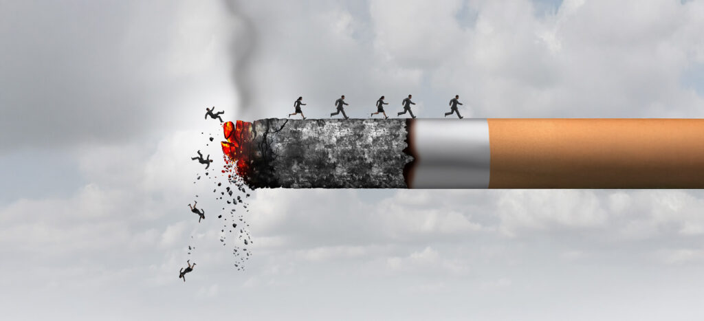 The burning cigarette and the person running and falling behind.