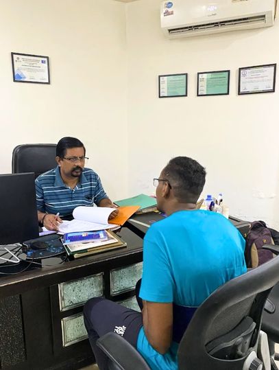 Doctor explaining rehab centre program to patients during a personal counselling session.
