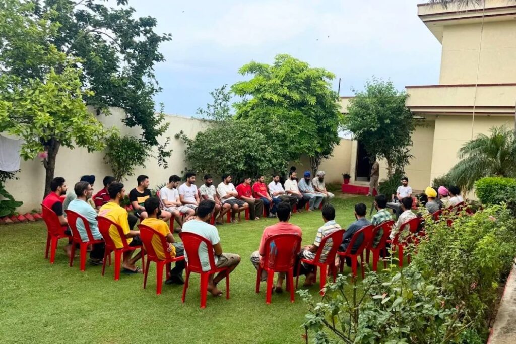 Group of people attending a recovery session at a rehab centre