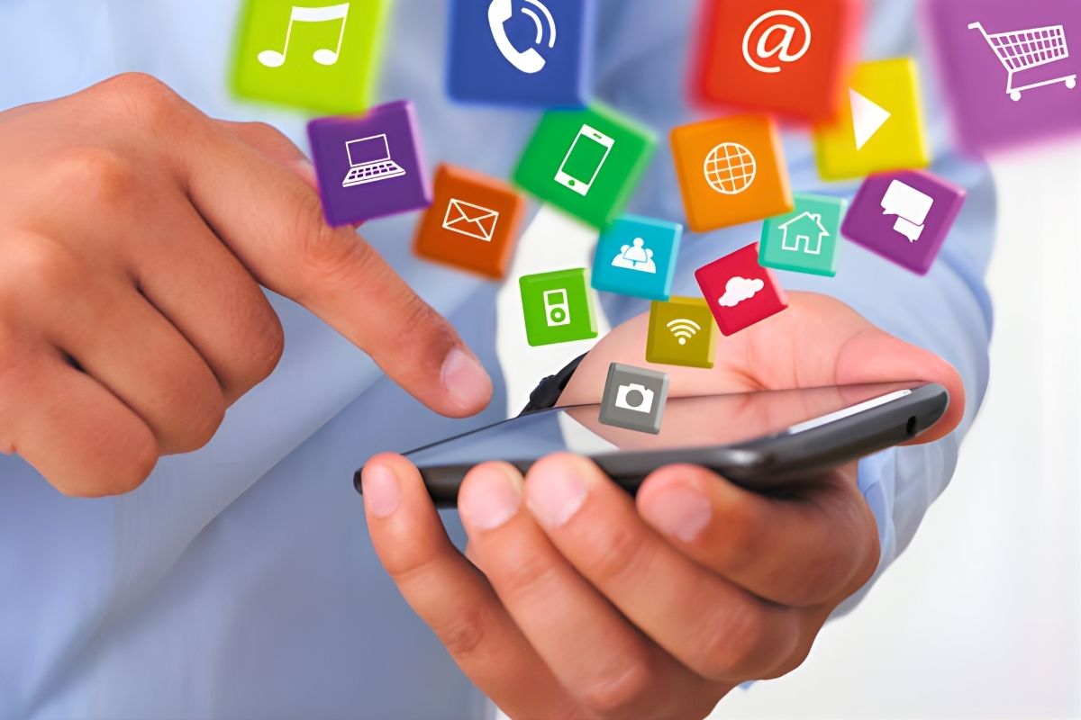 A person is holding a phone surrounded by social media content.