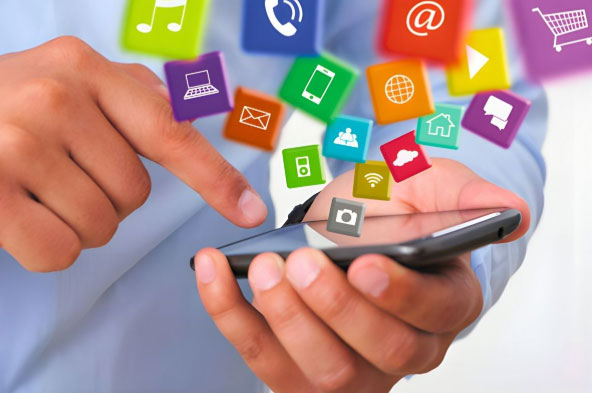 A person is holding a phone surrounded by social media content.